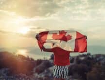 Girl waving Canadian flag