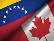 A Canadian and Venezuelan flag side by side.