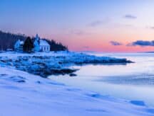 An image of a house on a frozen lake.