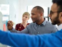 A group of workers in an office in Canada.