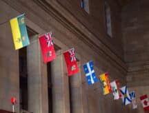 A row of provincial flags in union station, toronto.