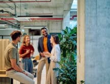 A group of IEC participants talking in a group.