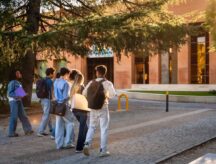 A group of international students walking on their campus.