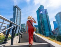 A woman walks up a flight of stairs in downtown Vancouver