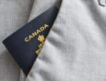 A picture of a Canadian passport tucked away in trouser pockets.