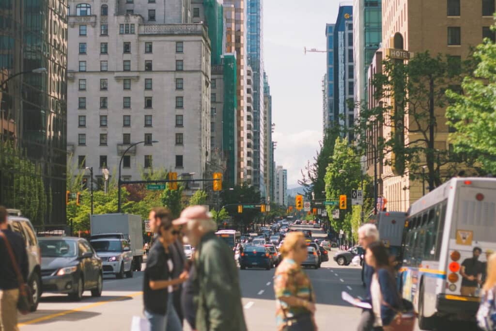 A group of people walking down the street in Vancouver