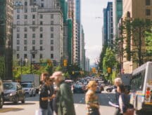 A group of people walking down the street in Vancouver