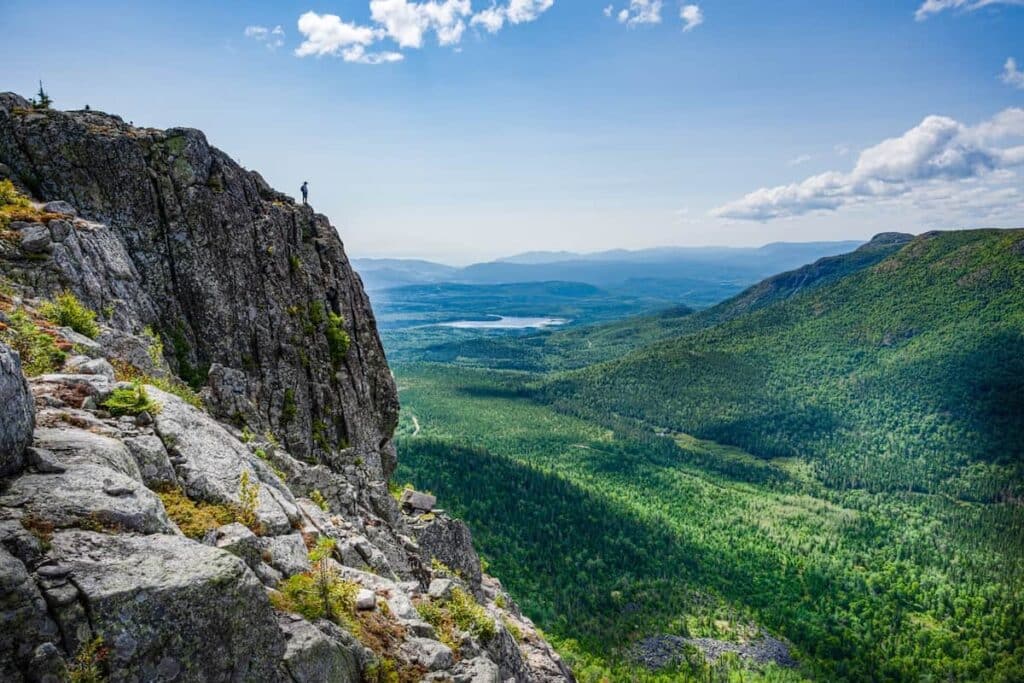 A man hiking in the hills of Quebec.