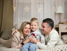 A happy Caucasian couple with their child