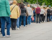 Many people waiting in a line.