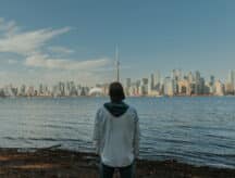 An international student looking at the Toronto skyline