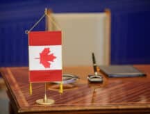 A Canadian flag on a desk