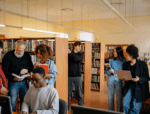 people reading books in the library