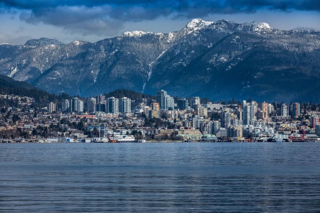 Rocky Mountains and buildings in North Vancouver, British Colombia, Canada.