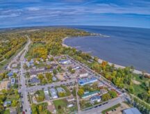 A shot of Winnipeg Beach, with surrounding homes and roads.