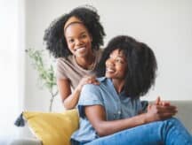 A happy mother and adult daughter.