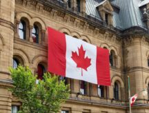 Canadian flag on Office of Prime Minister building on Canada Day in Ottawa.