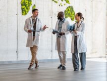 Group of medical professionals walking together in a hospital.