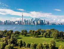 Aerial view of the Toronto skyline and Lake Ontario.