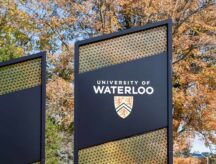 University of Waterloo (UW) sign seen at the main campus entrance in Waterloo, ON, Canada