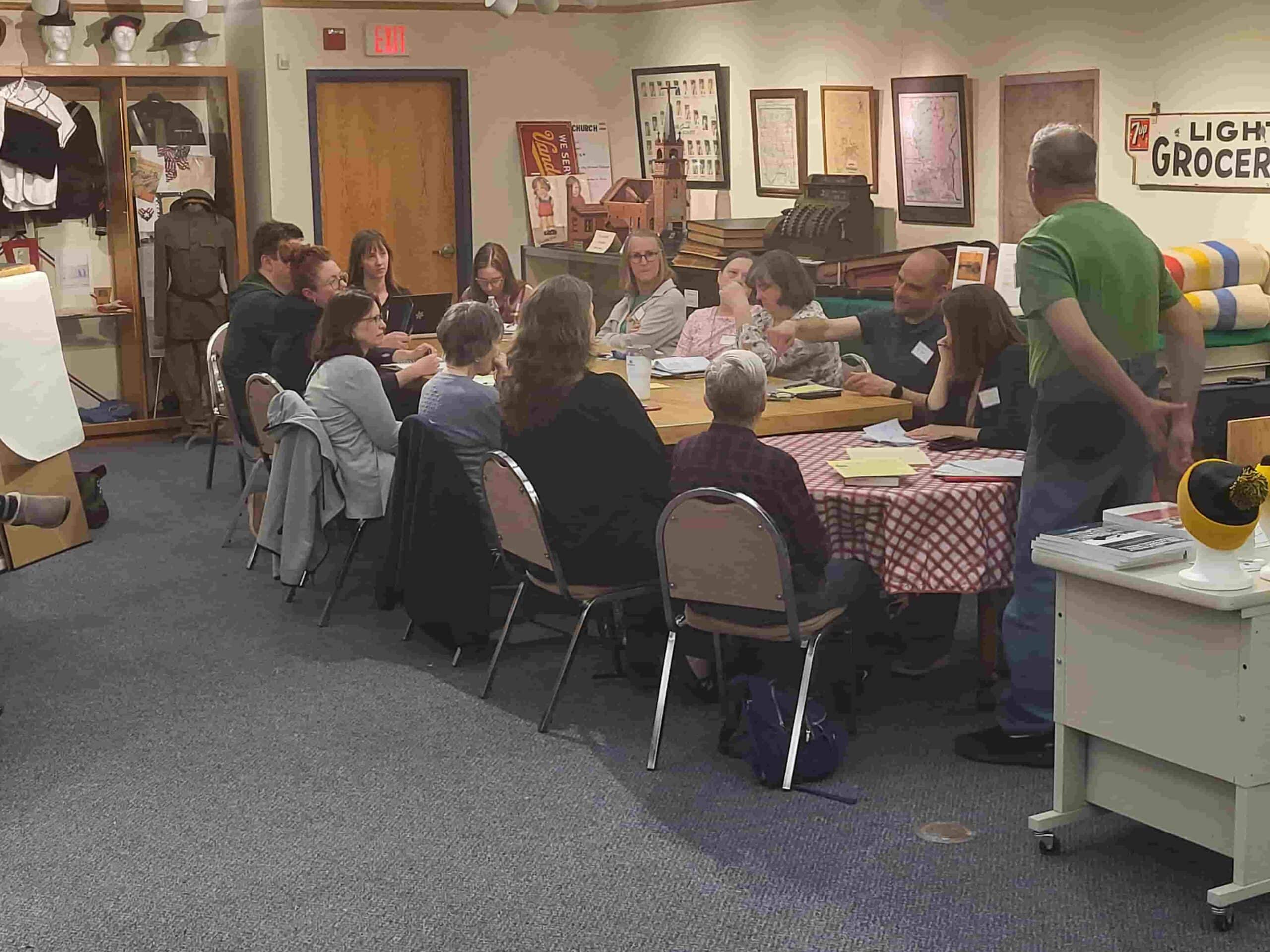A group of people gather for advice on Canadian citizenship by descent applications