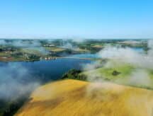 Aerial View of a Coastal City and Harbor in Prince Edward Island, Canada with morning mist.