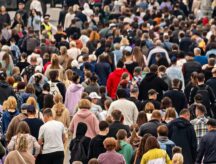 A large crowd of people walking.